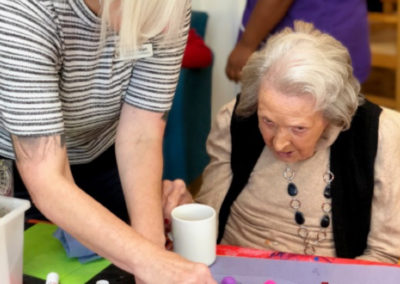 Bromley Park Care Home residents making Halloween decorations with arts and crafts materials