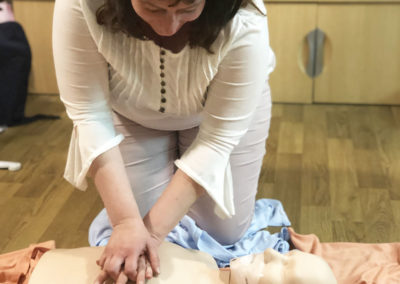 Bromley Park staff member using a first aid CPR dummy