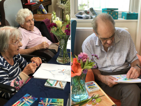 Residents sketching and colouring flower pictures