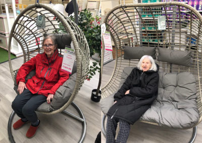 Two ladies from Bromley Park trying out garden furniture at Polhill Garden Centre