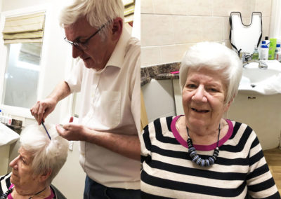 A lady resident at Bromley Park having her hair done by Hairdresser Rob