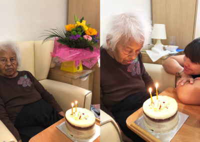 Resident with her birthday cake at Bromley Park