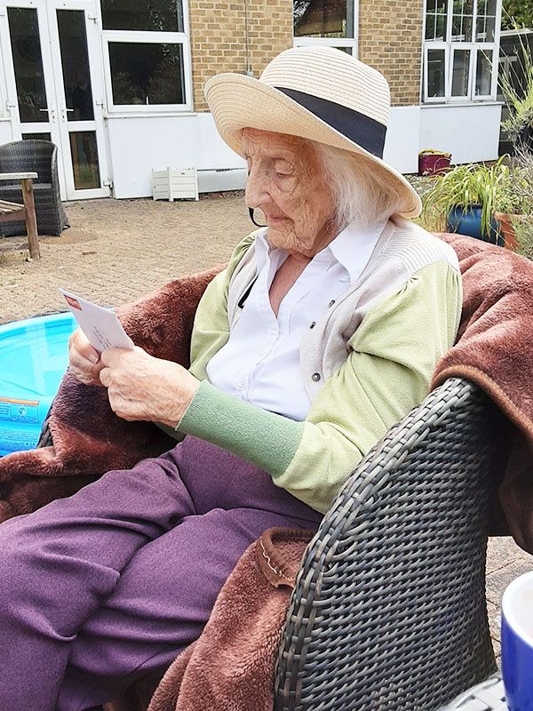 Dorothy at Bromley Park Care Home reading a later from a friend