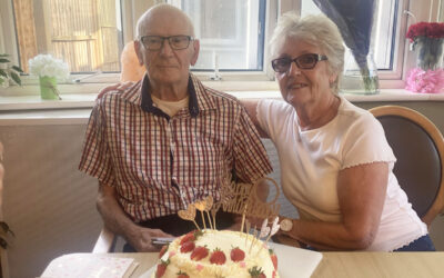 Derek and Daphne with their anniversary cake at Bromley Park Care Home