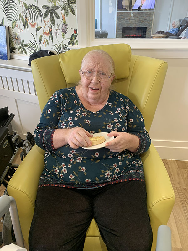 Bromley Park Care Home resident enjoying a crumpet